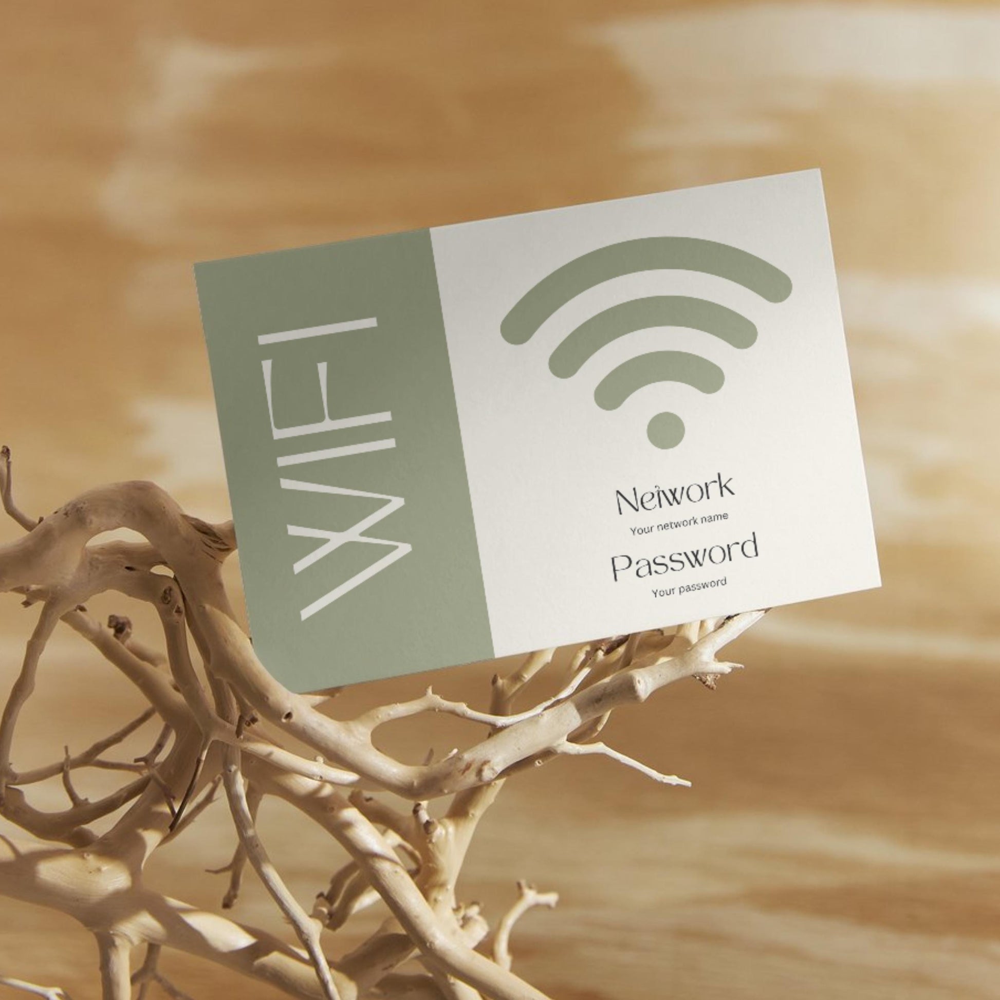 Minimalist WiFi card design, displaying placeholders for network name and password, propped on decorative driftwood against a warm wooden background.